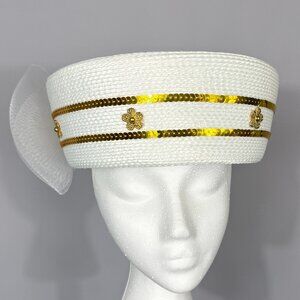 White hat with narrow gold band decoration